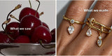 Cherries that inspired an Oomiay ring, beside the finished ring