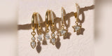 A row of Oomiay hoops with dangling charms