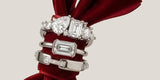 Sterling silver Oomiay rings stacked on a red velvet bow