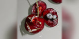 Oomiay rings with crystals resting on red cherries