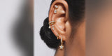 Gold Star Bezel Huggies in a coordinated ear stack