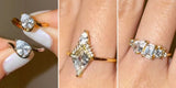 Three hands showing stone shapes: two pear rings, a long marquise-shaped ring and an emerald-cut cluster ring
