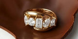 Oomiay gold rings resting in melting chocolate