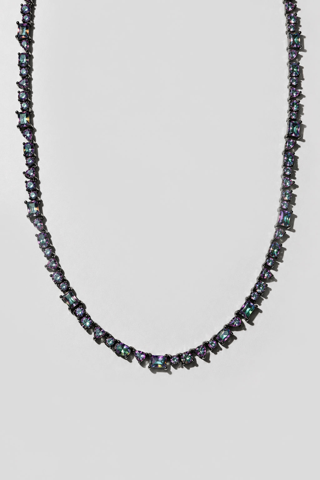 Mystic Topaz Mixed Shape Tennis Necklace. Hand-linked tennis necklace of mixed shape mystic topaz crystals: round, oval, pear, emerald cut, square and triangle