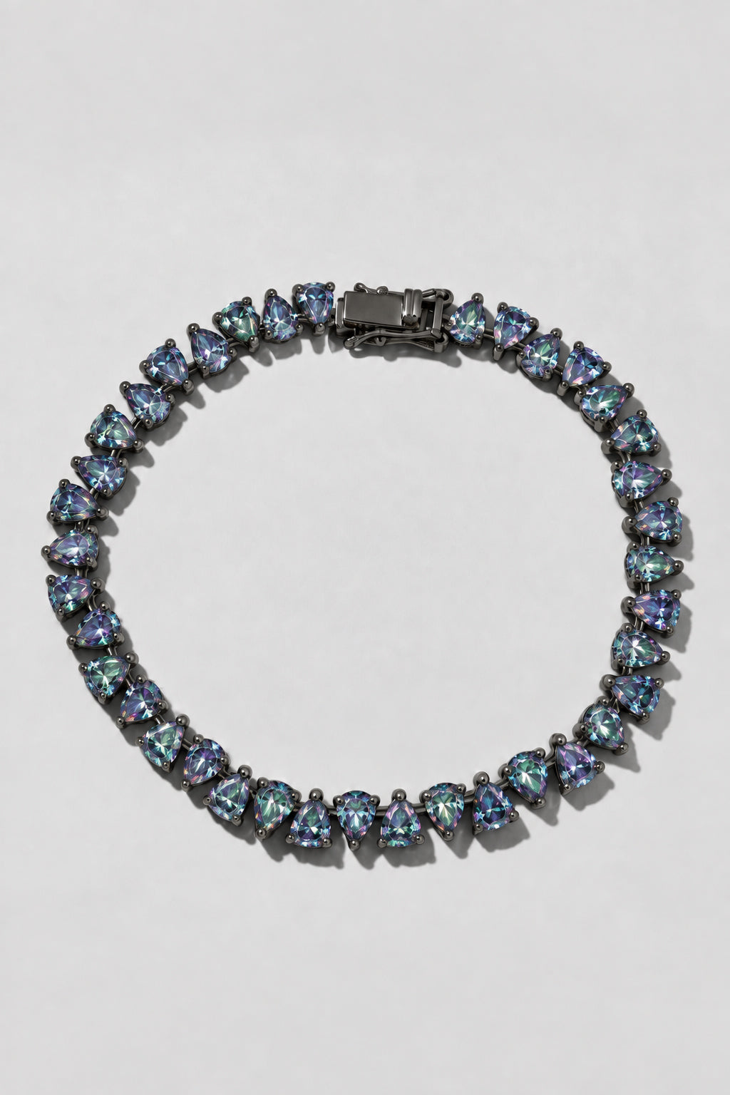 Mystic Topaz Reverse Pear Cut Tennis Bracelet. Hand-linked tennis bracelet of 5x7mm reverse pear cut mystic topaz crystals