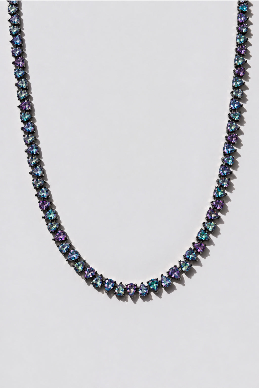 Mystic Topaz Reverse Pear Cut Tennis Necklace. Hand-linked tennis necklace of 5x7mm reverse pear cut mystic topaz crystals, spaced with a gap between each stone so it lays flat