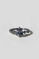 Nutcracker Black Gold Ring with a pear mystic topaz crystal and four mystic topaz side stones