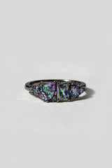 Posey Black Gold Ring with a pear, emerald-cut, and round mystic topaz cluster