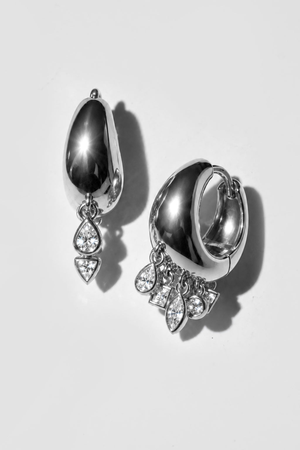 Silver Cascade Earrings. Chunky dome hoop with five bezel crystal charms: pear, marquise, round, square and triangle