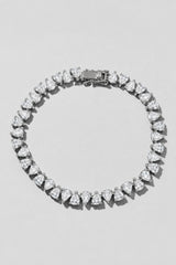 Silver Reverse Pear Cut Tennis Bracelet. Hand-linked tennis bracelet of 5x7mm reverse pear cut white crystals