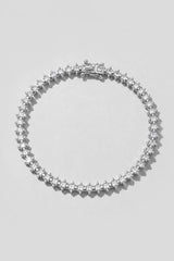 Silver Spike Tennis Bracelet. Hand-linked tennis bracelet of 2.5mm square crystals framed by spike accents